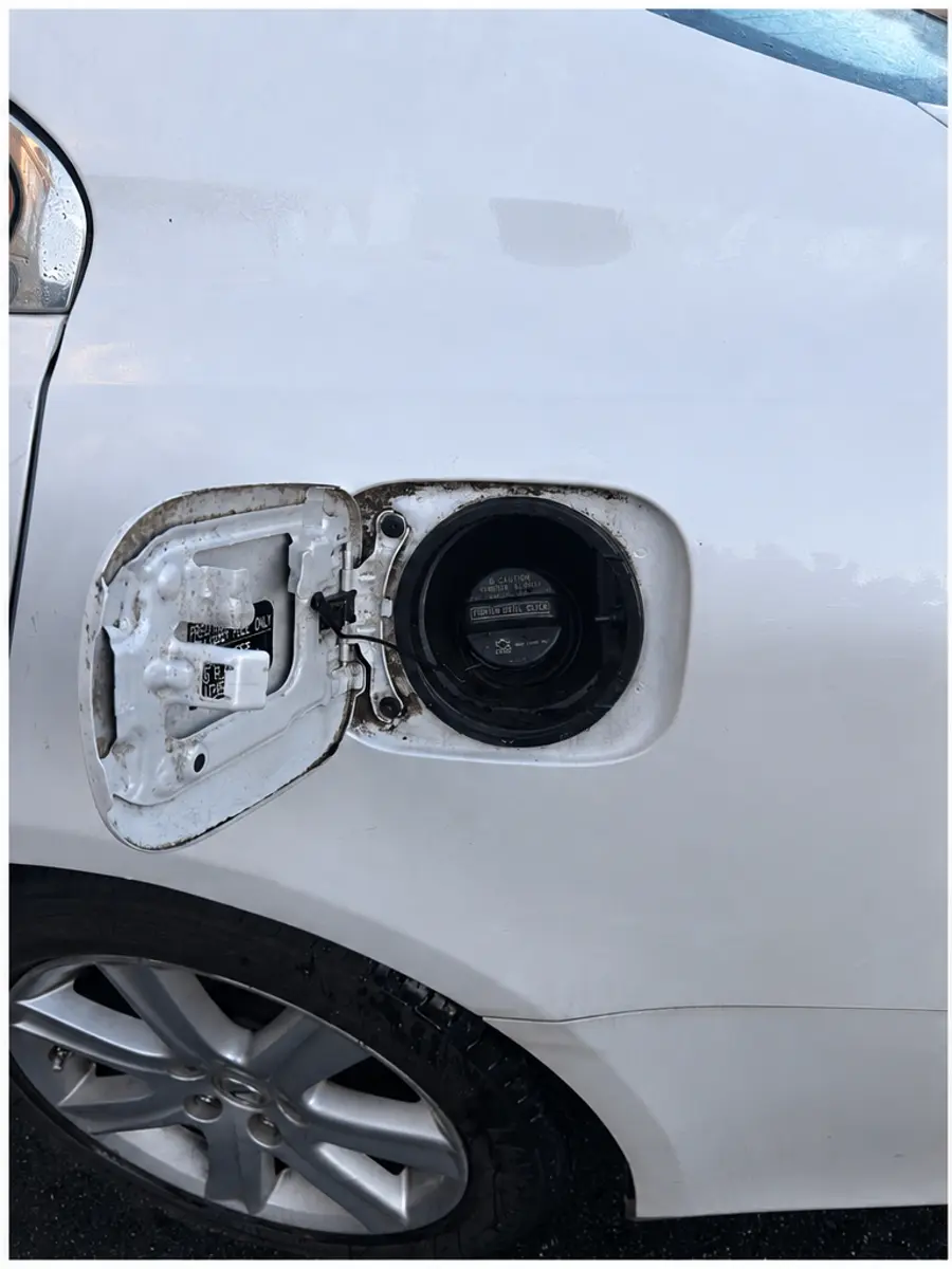 Fuel door area before cleaning